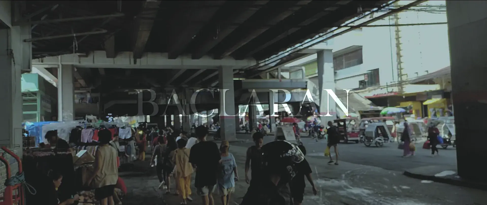 Title card for the short film 'Baclaran', showing shoppers and vendors crowding the market beneath the overpass